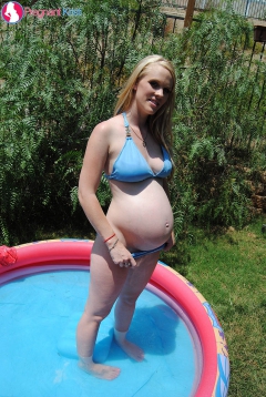 Kristi showing off her breast while in a small pool