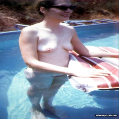 Nudist amateurs in and around the pool - N