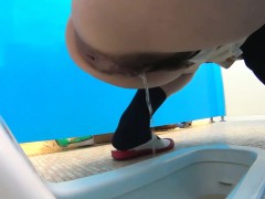 Peeing asian babes filmed
