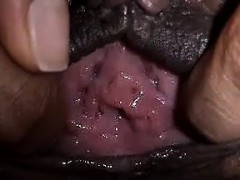 Ebony spreads her pussy close up