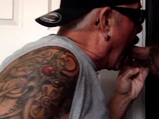 Tattooed oral DILF sucks gloryhole dick