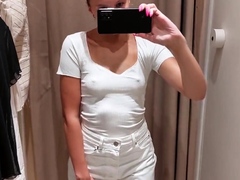 Sexy cutie takes a video of herself in the fitting room of t