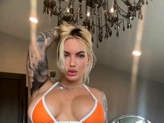 Blonde babe shows her big boobs in public